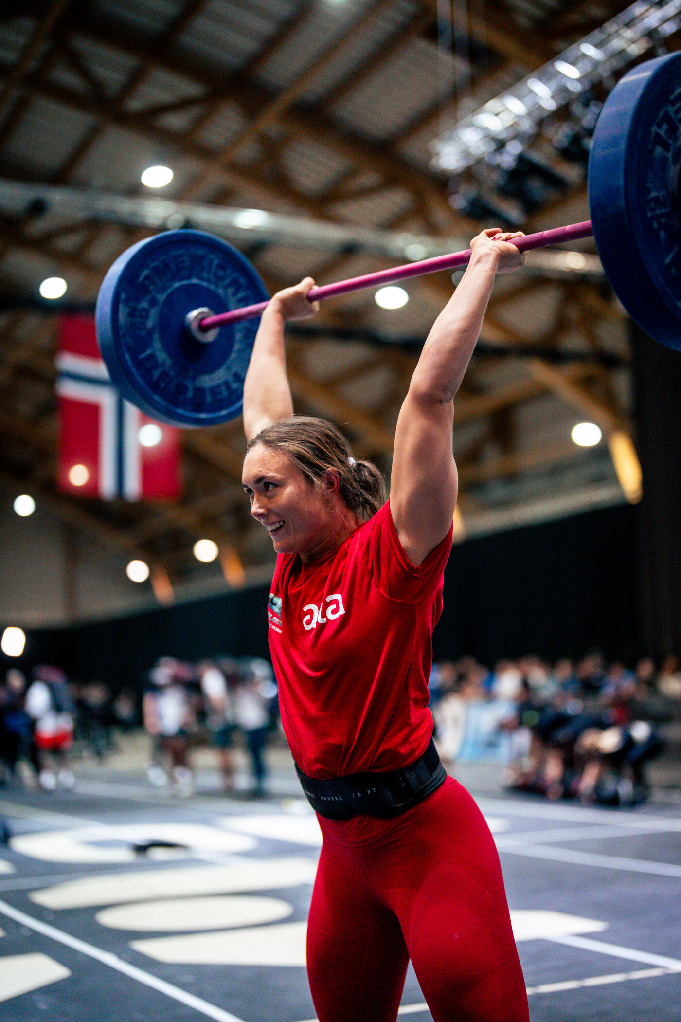 Athlete overhead barbell at competition